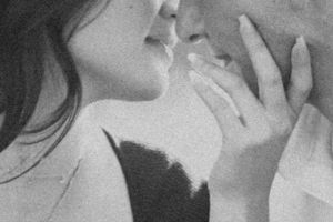 A tender black and white close-up portrait capturing an intimate moment.