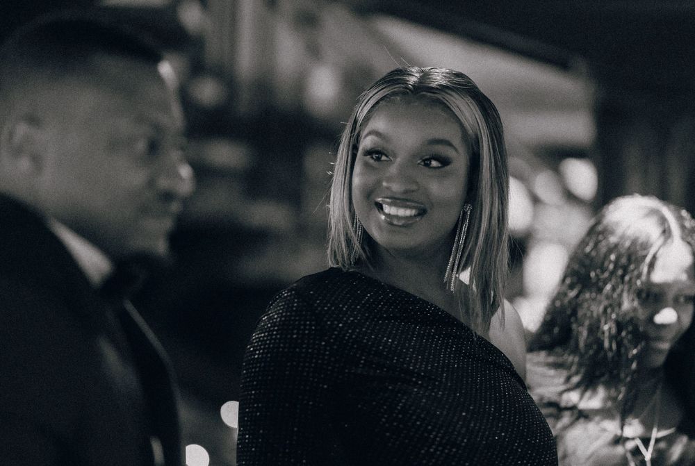 The atmosphere of an evening social gathering captured in black and white photography.