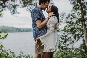 Engagement session along a lake in the woods near Perth, Ontario