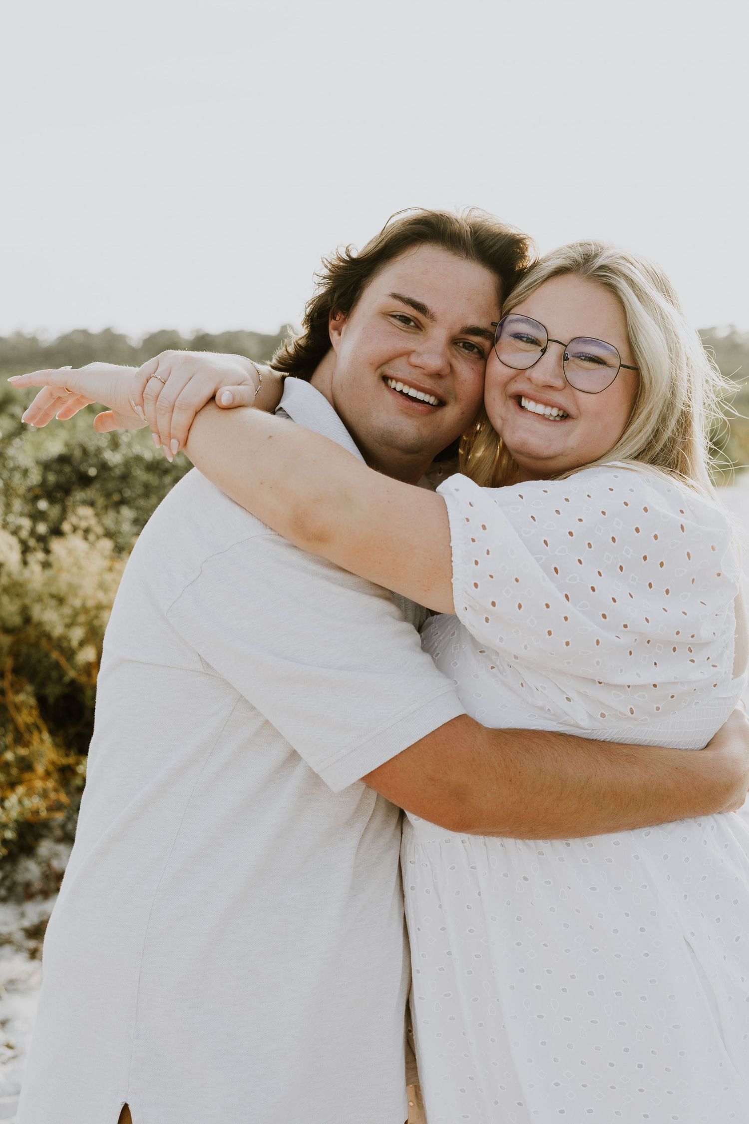 Golden hour proposal photos of a couple on the nature trail and dunes of Juno Beach, Florida captured by Lindsay McDow Photography