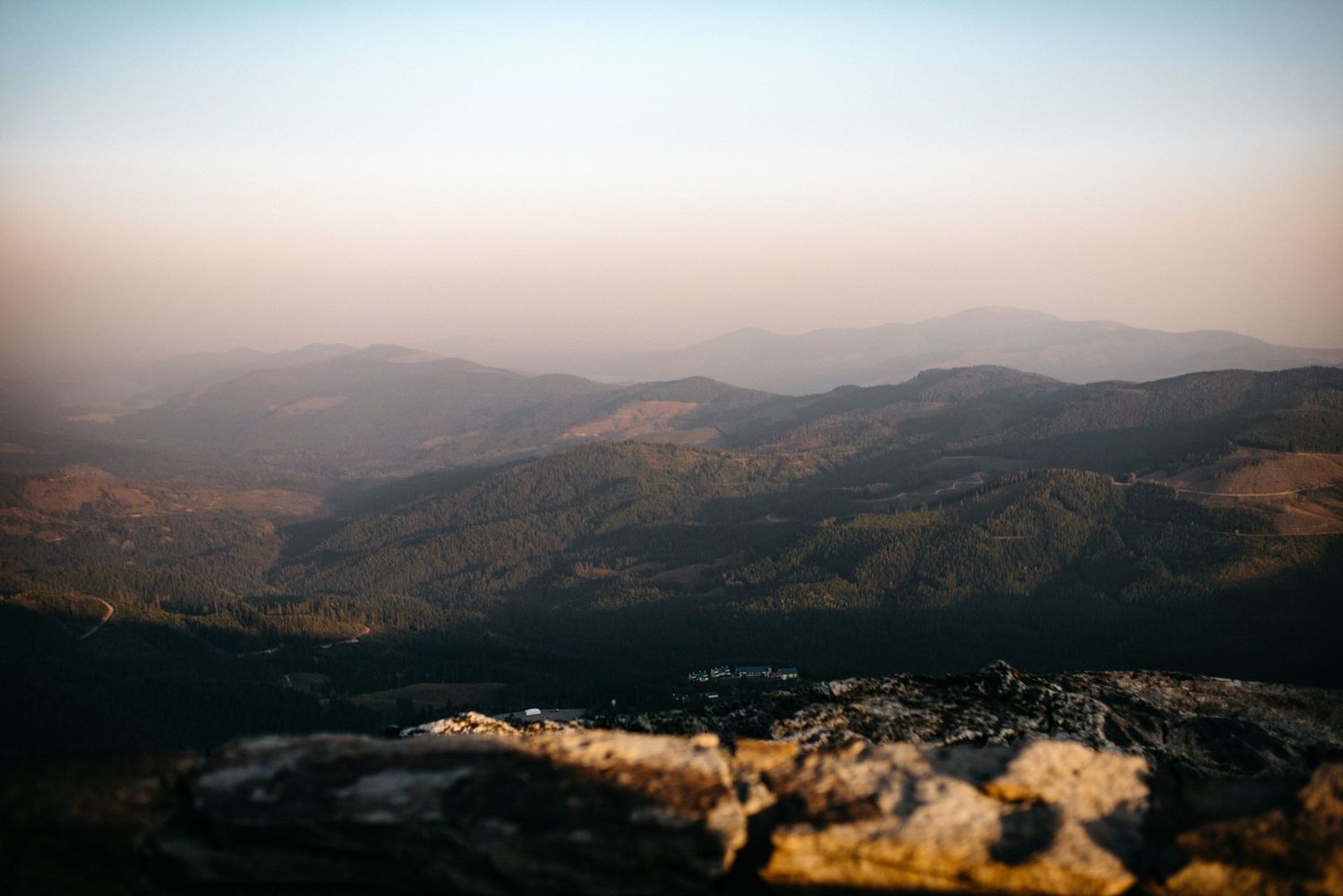 A hazy view of mountains from the top of Mount Spokane in Washington.