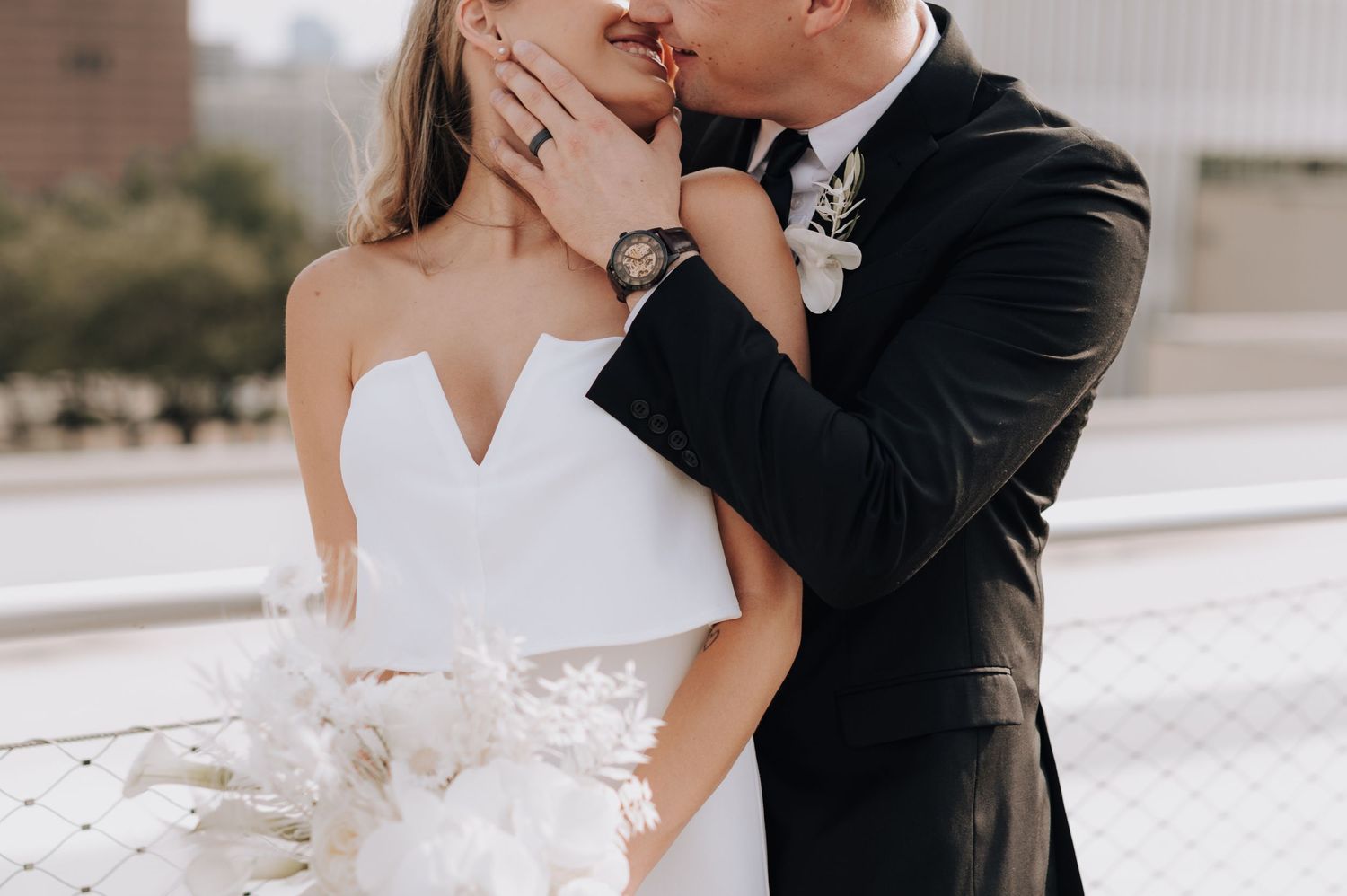 Intimate close-up of wedding couple sharing tender moment.