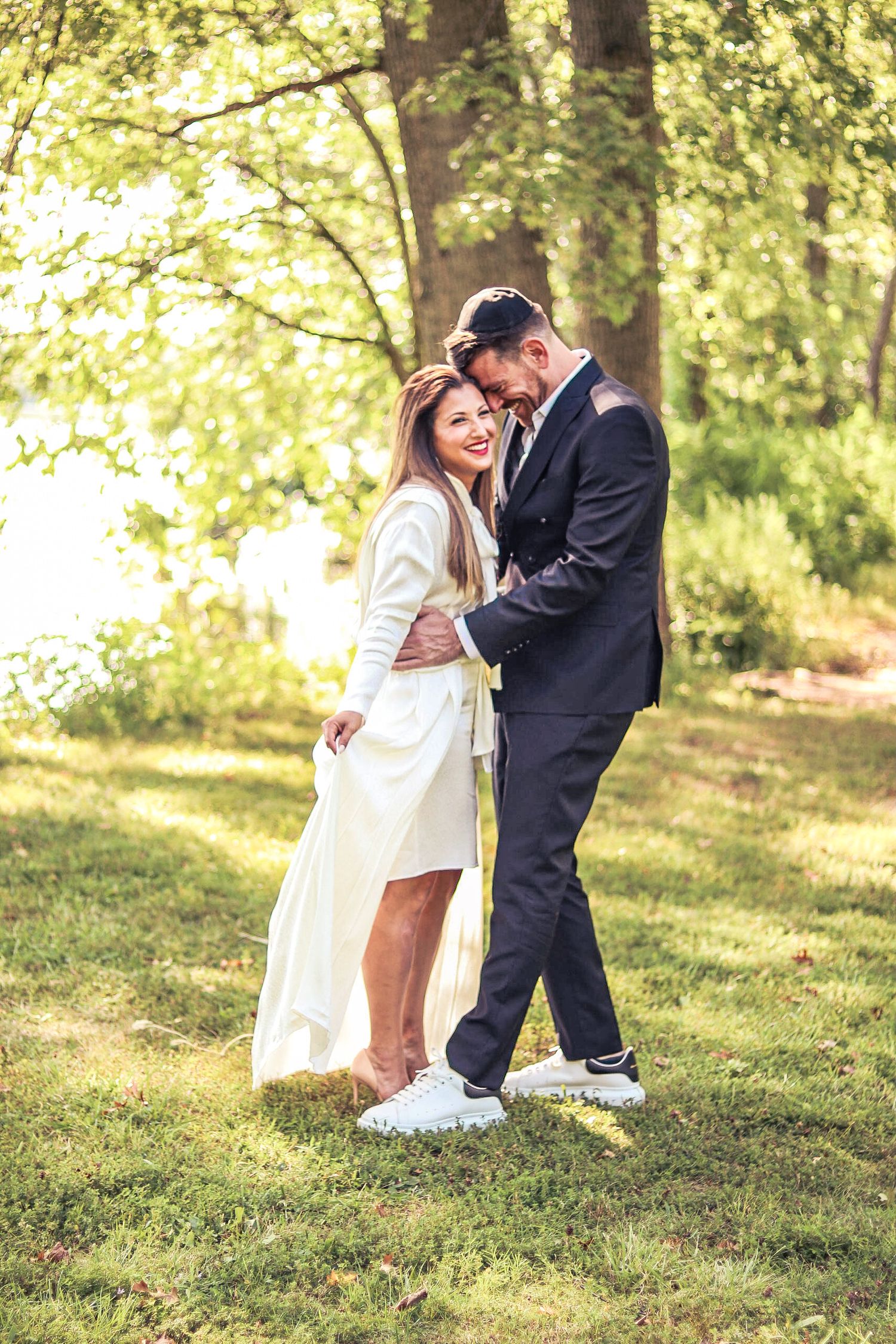 Natural-light photo of a couple with a cute pose. Taken by a professional photographer.