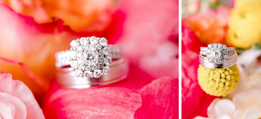 Close-up of elegant diamond engagement ring and wedding band on pink floral background.