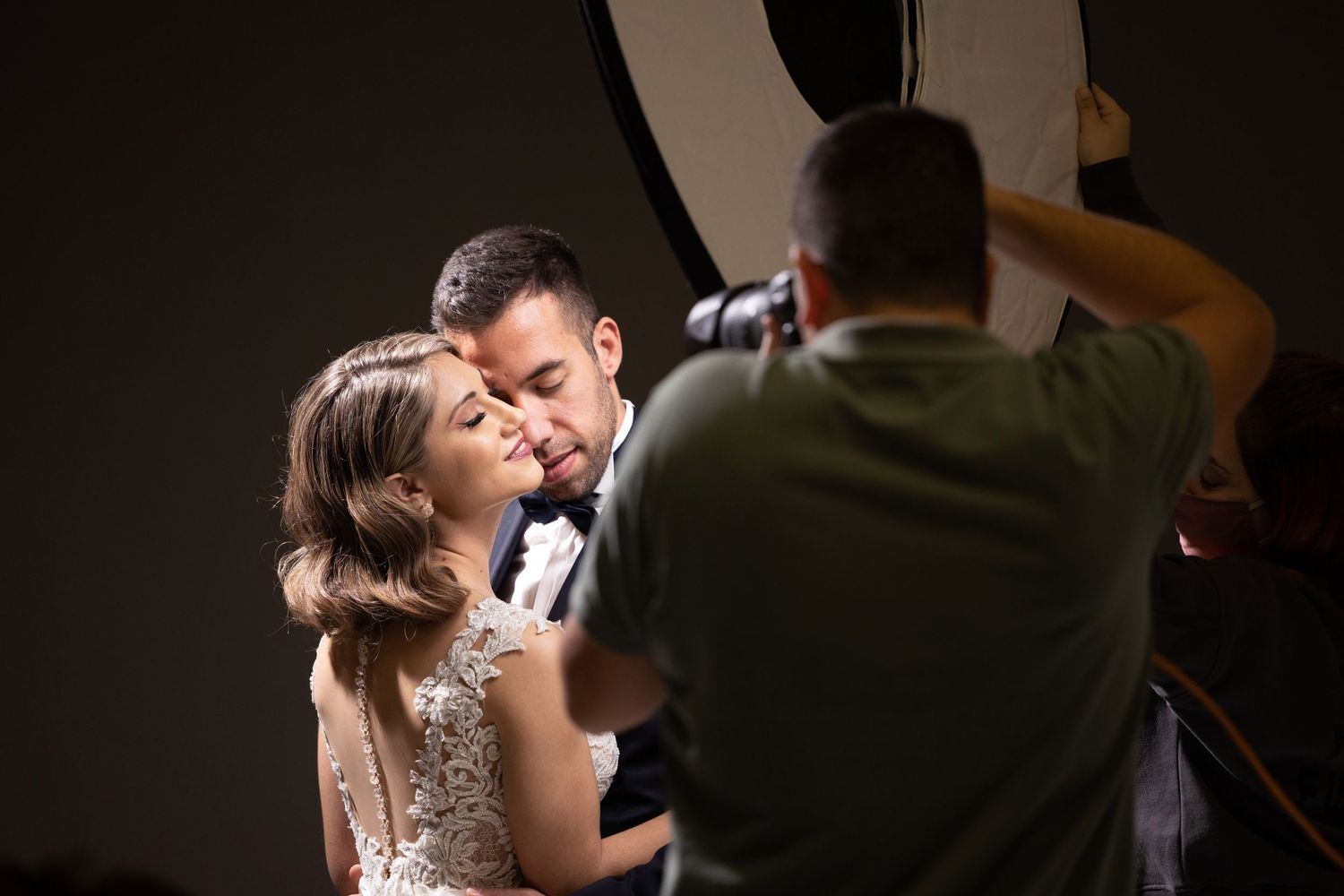 Low-light indoor photography session with professional lighting setup.