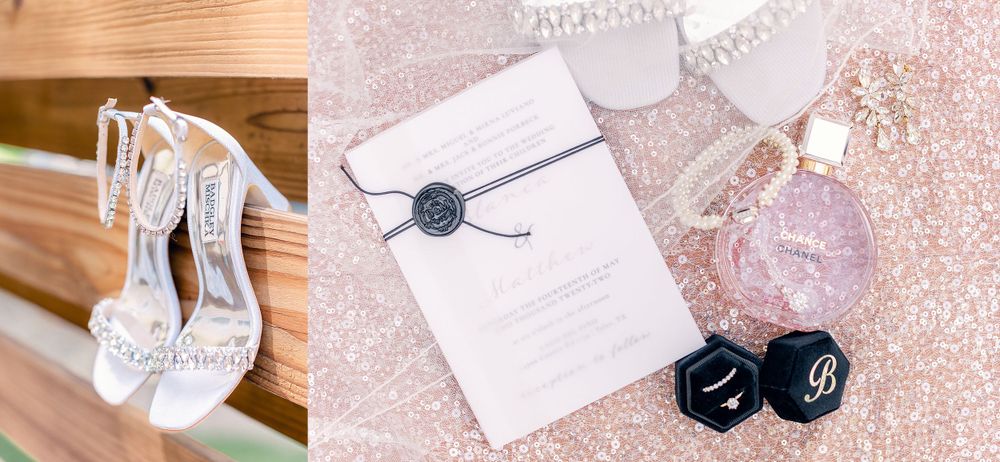 Wedding accessories including white heels and invitation with navy wax seal on sparkly background.