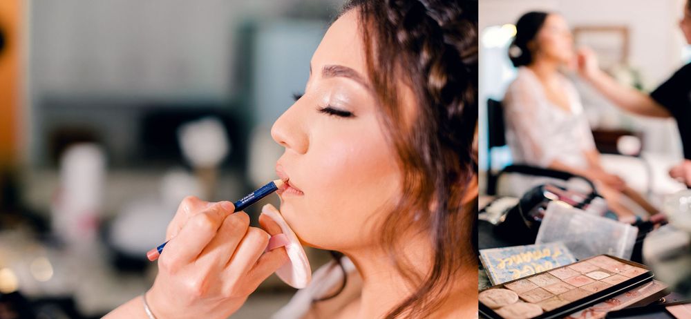 Wedding makeup artist applying cosmetics in preparation for the ceremony.
