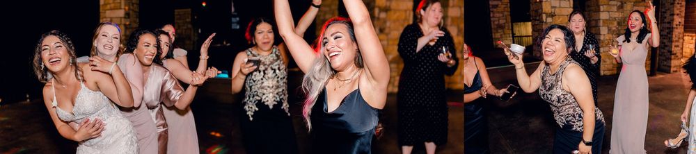 Wedding guests dancing and celebrating enthusiastically at an evening reception.