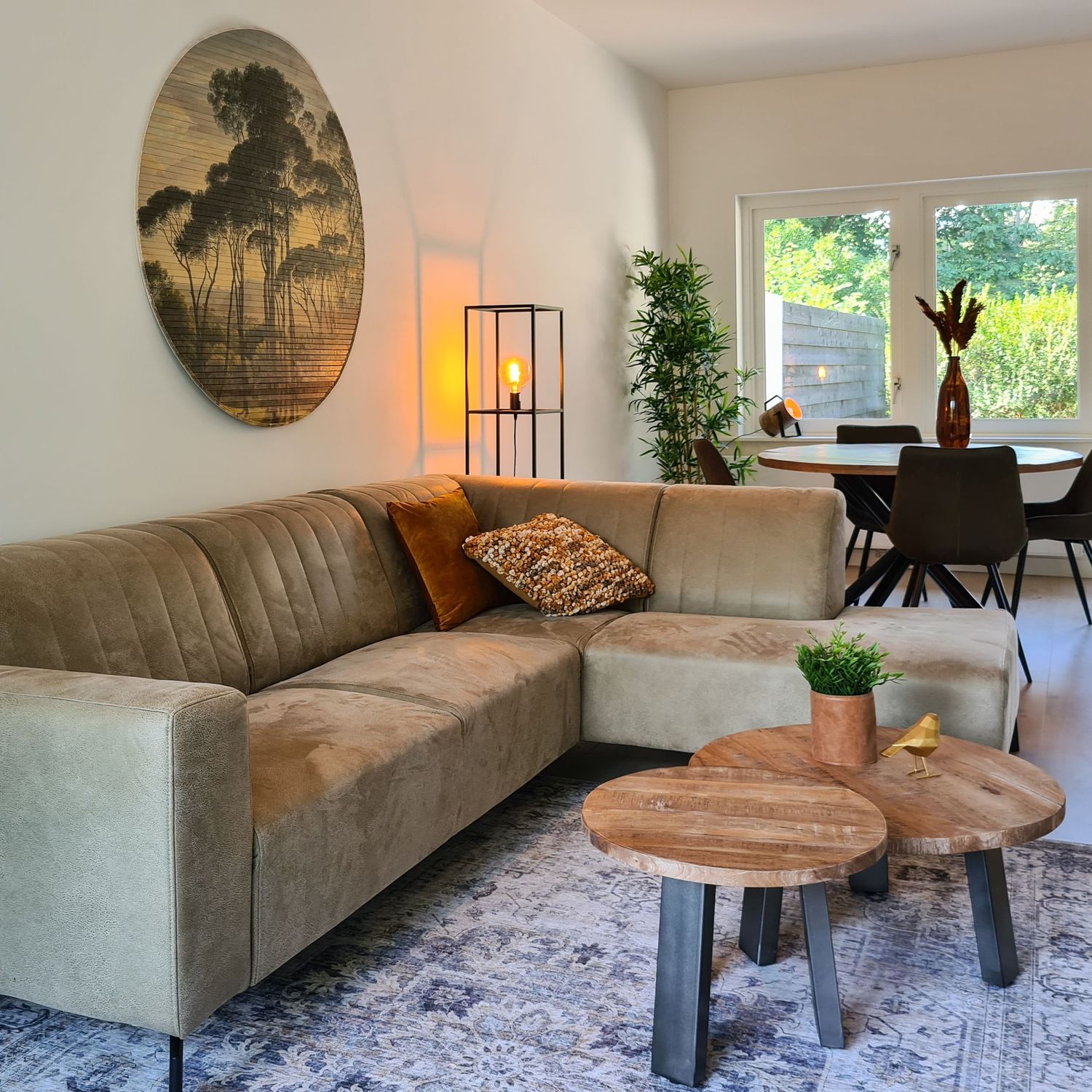 Large sofa in industrial style with mango-wooden coffe table set and vintage rug