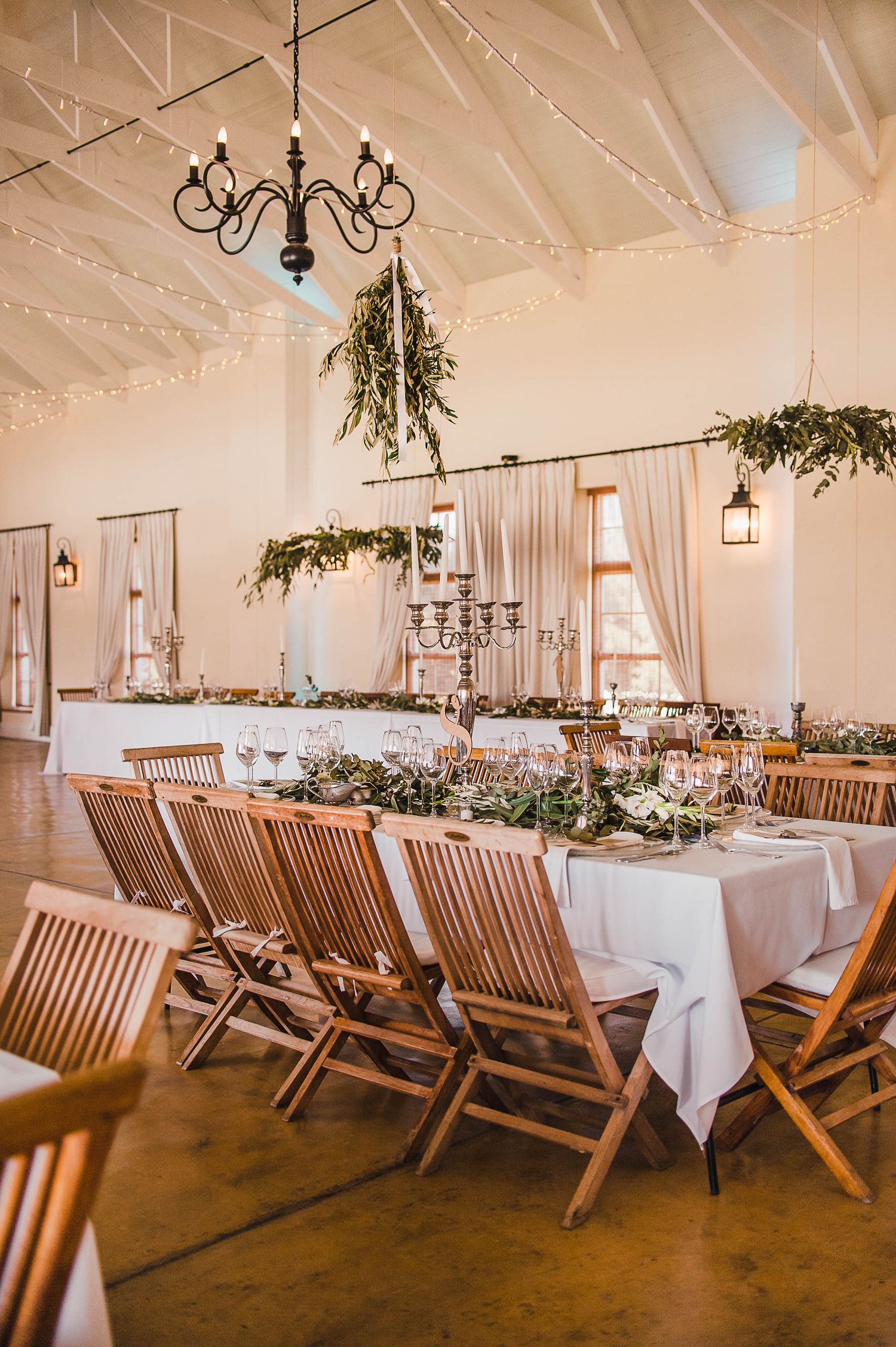 wedding reception decor with wooden chairs