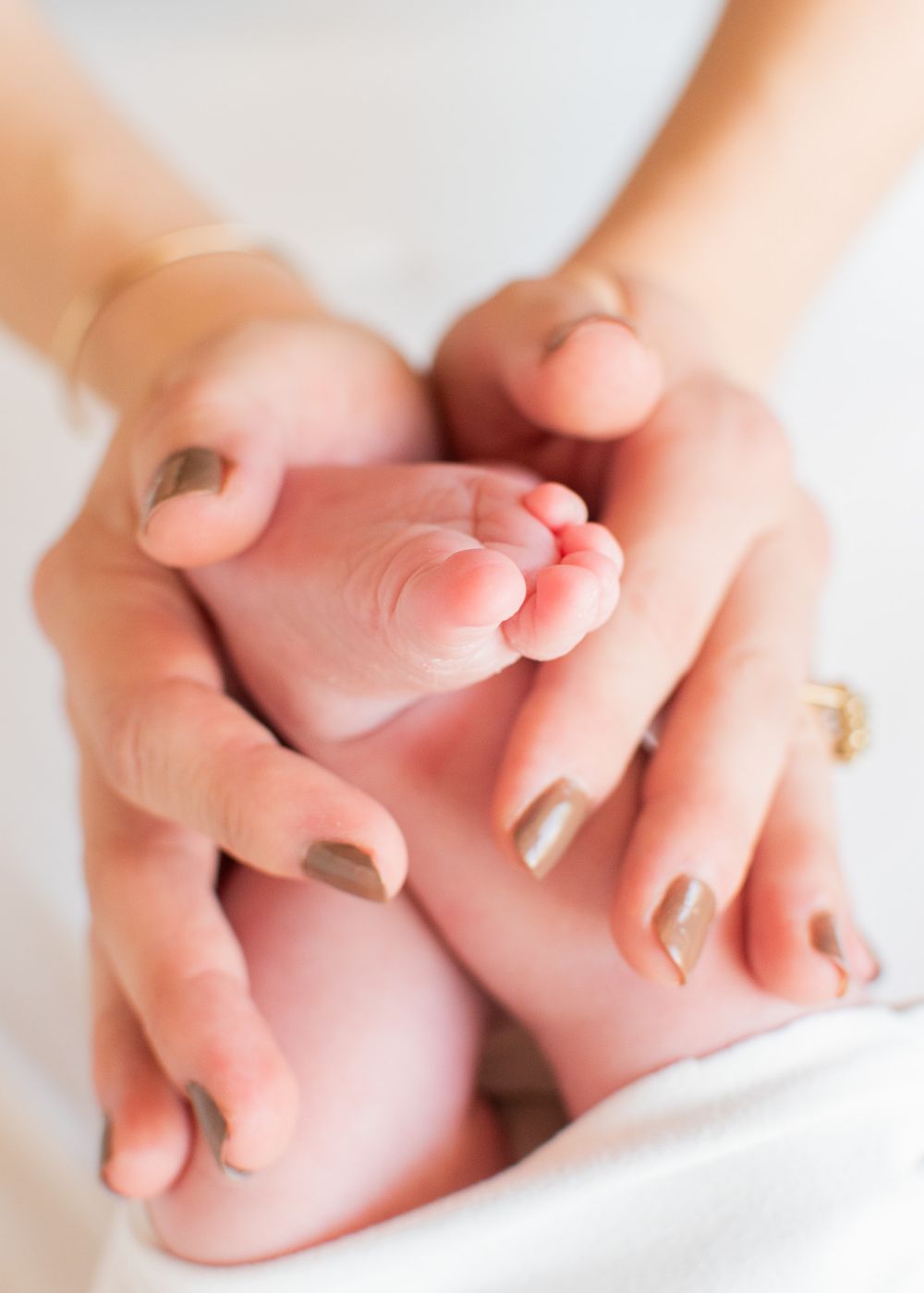 mom and newborn daughter's hands