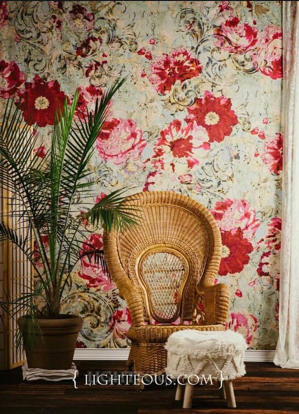 Vintage-inspired set with floral wallpaper, peacock chairs and tropical plants.