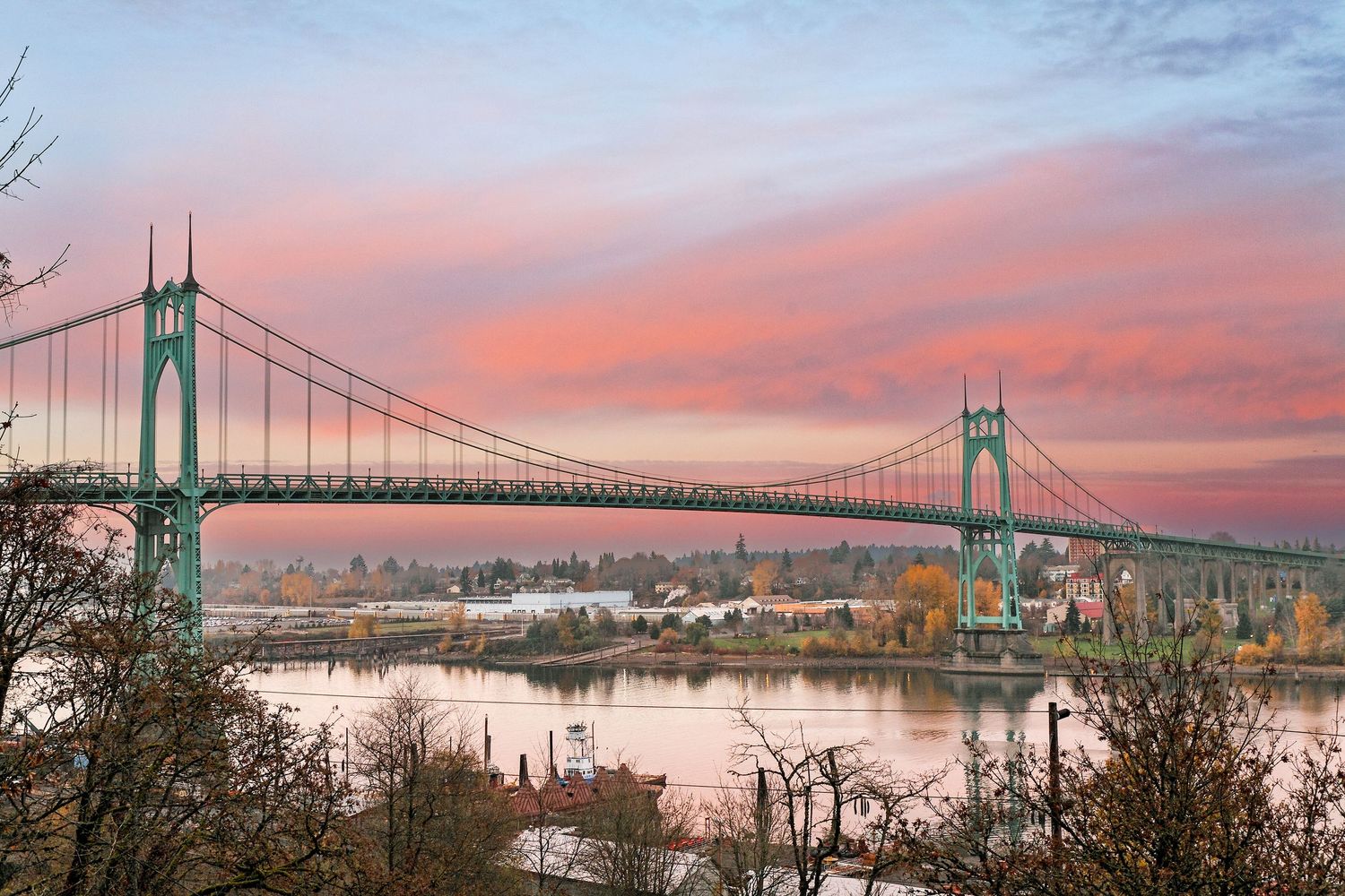 Colorful sunset behind the St. John’s Bridge in Portland, Oregon looking northeast