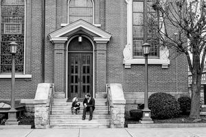 Series of black and white architectural photographs showing the entrance of a classic brick church building.