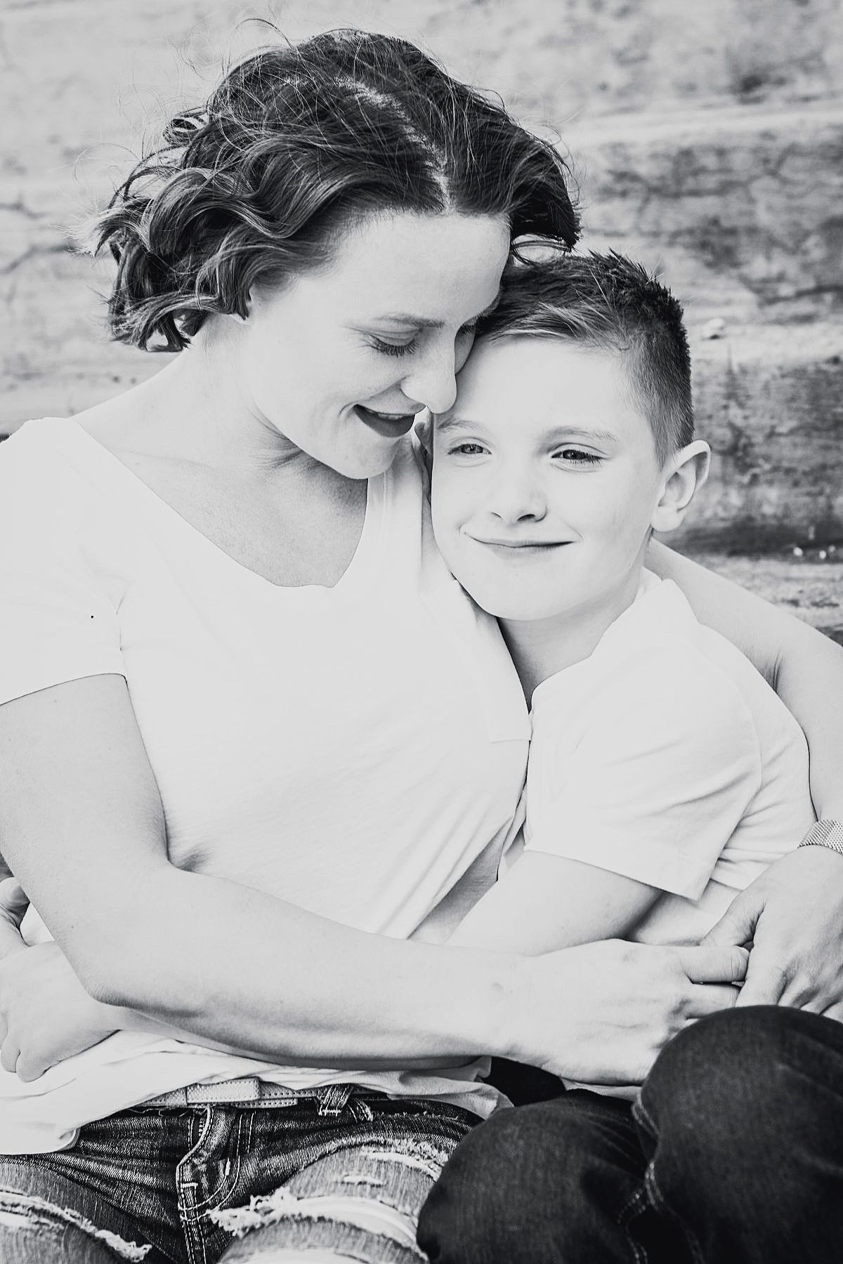 Intimate black and white lifestyle portraits on textured background.