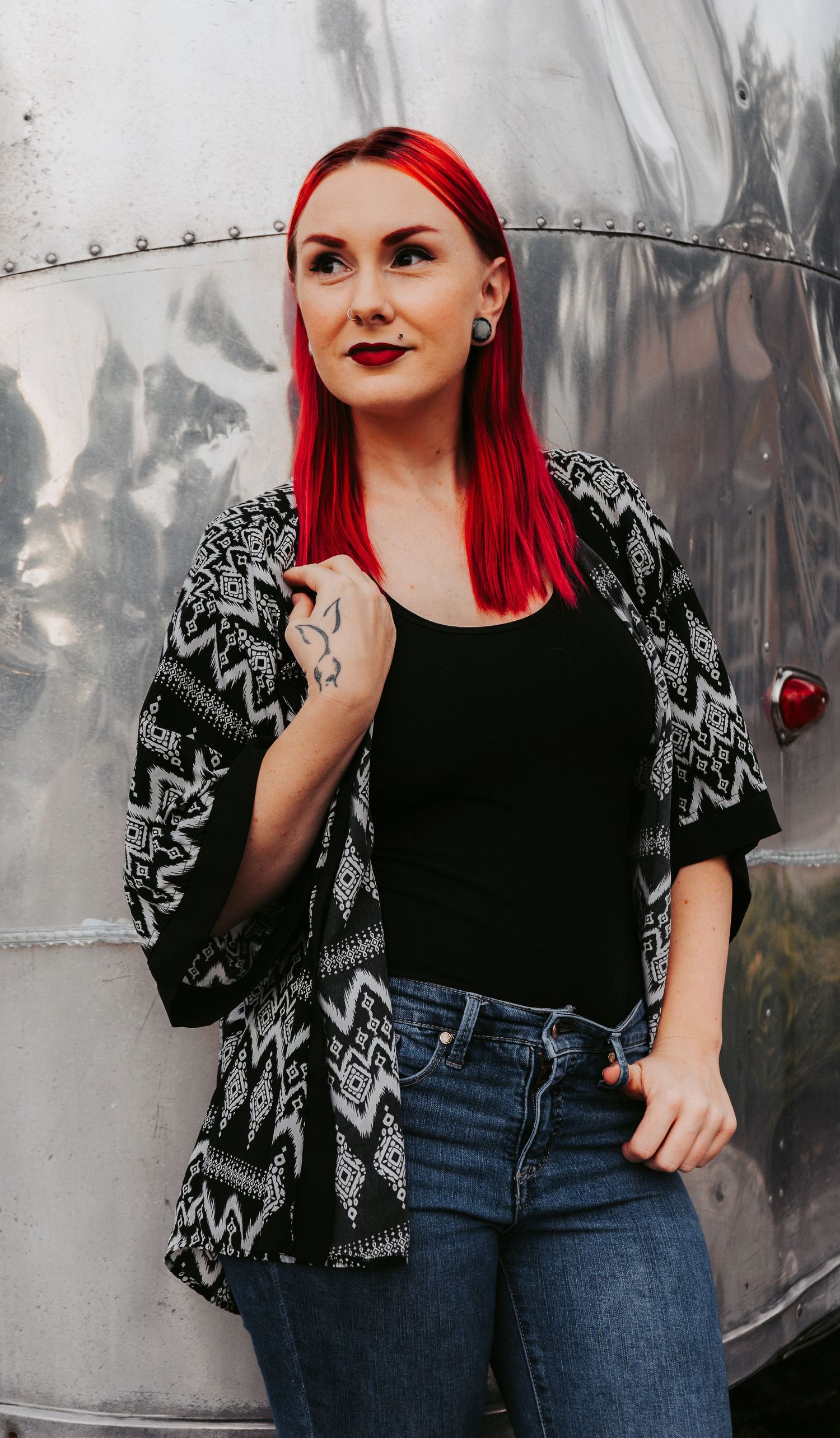 Outdoor Headshot Session at Winthrop Plaza in Riverview, FL; woman leaning against airstream rv