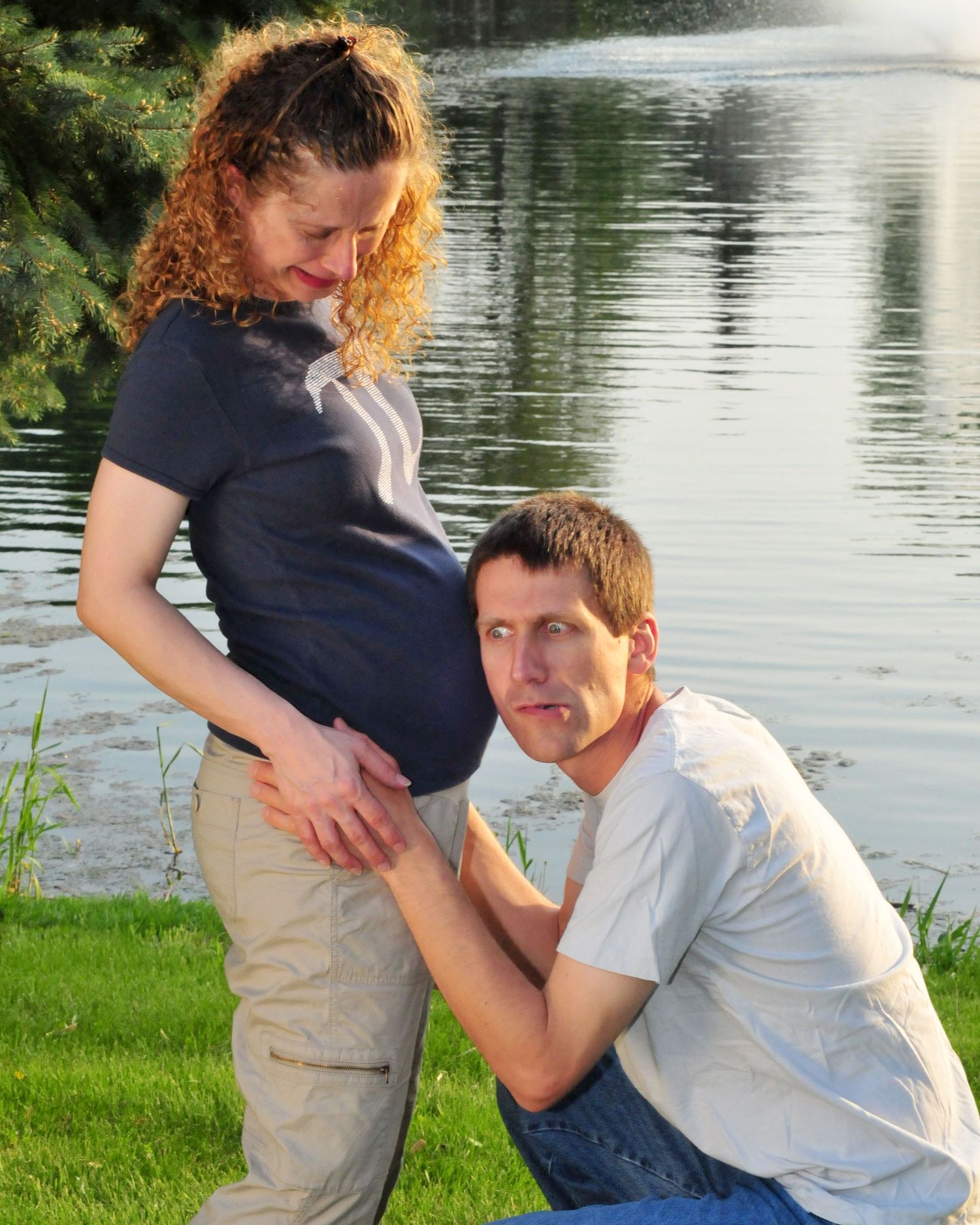 funny baby moves expression maternity couple photo