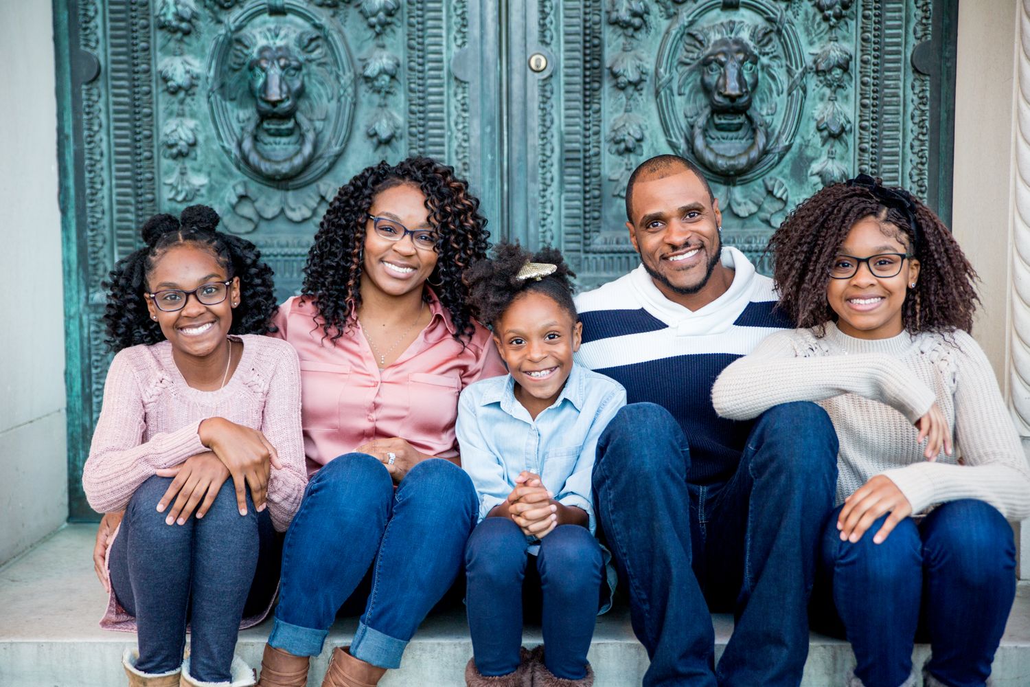 Stunning and ornate green doors of Maryland State House flank this beautiful african american family in Annapolis Photo