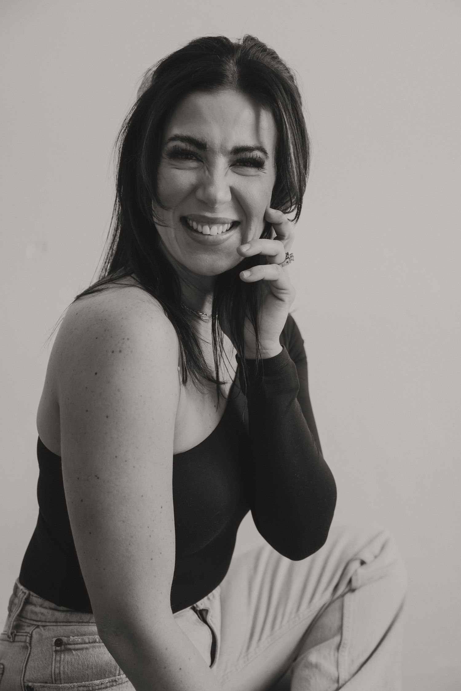 Black and white portrait showing genuine laughter and joy.