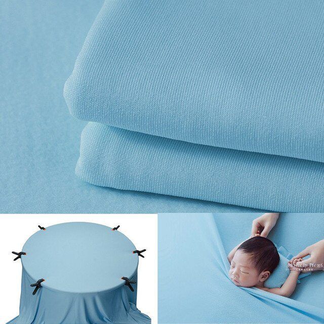 Light blue stretchy fabric material with folded texture.