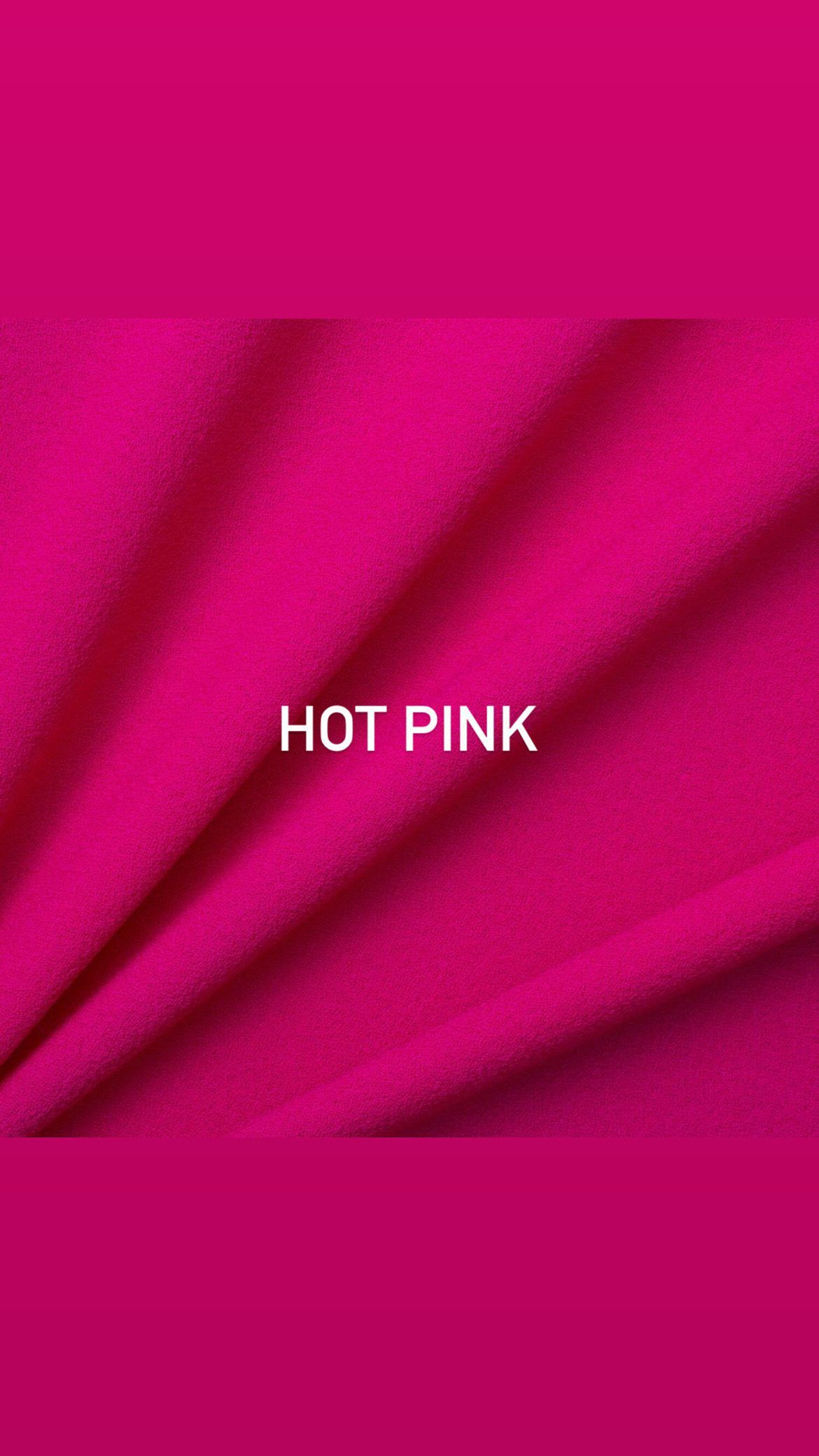 Hot pink textile fabric with diagonal draping showing material texture.