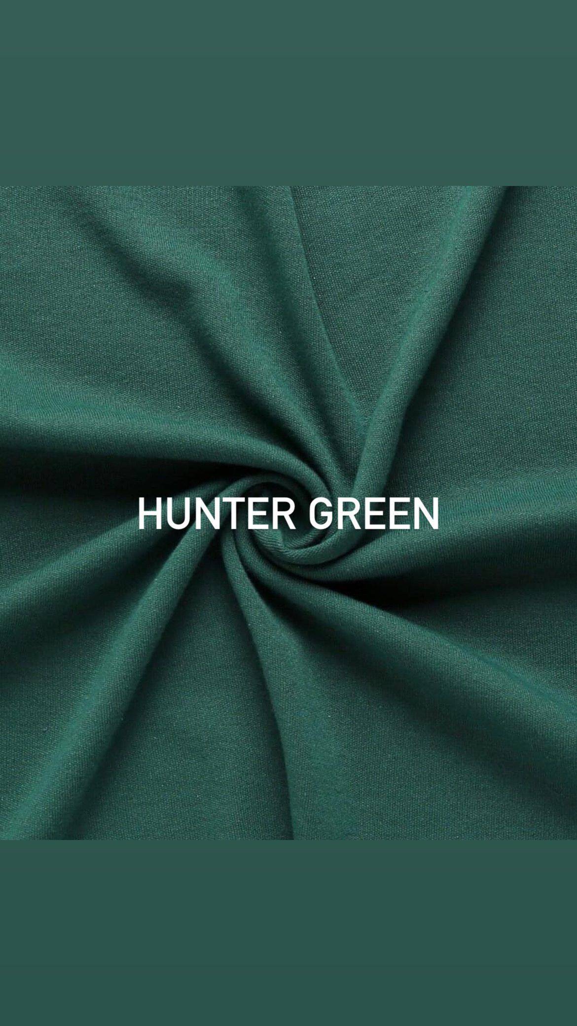 Hunter green textile fabric with twisted center showing material texture.