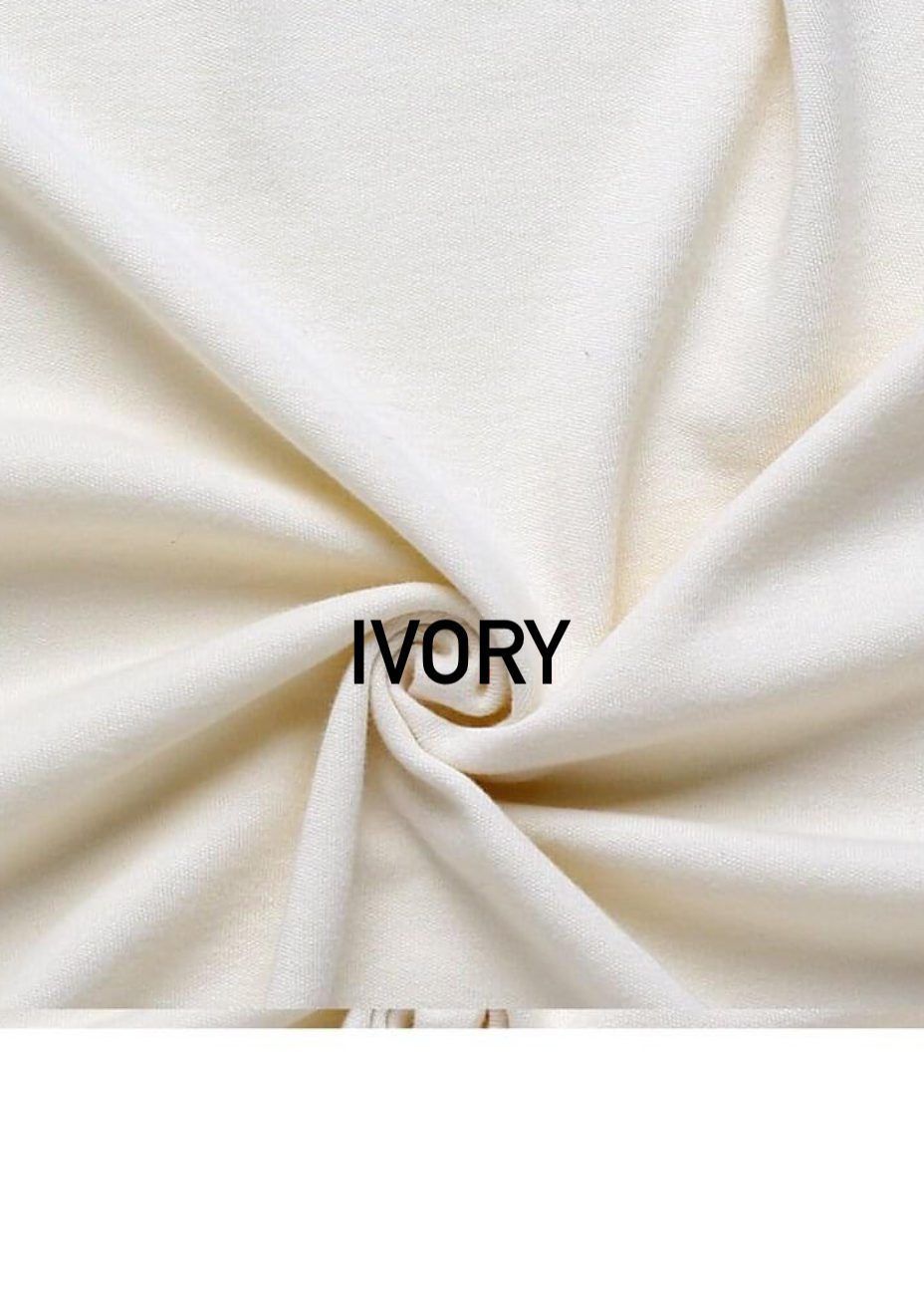 Ivory white textile fabric with twisted center showing soft material texture.
