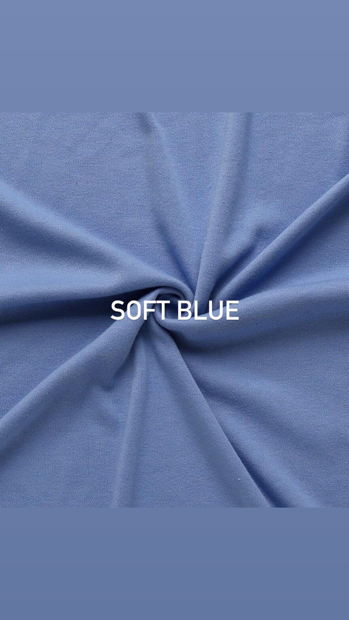 Soft blue fabric gathered in a spiral pattern with white text label.