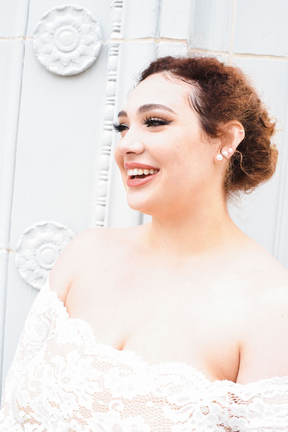 Bride Looking out with courthouse behind her
