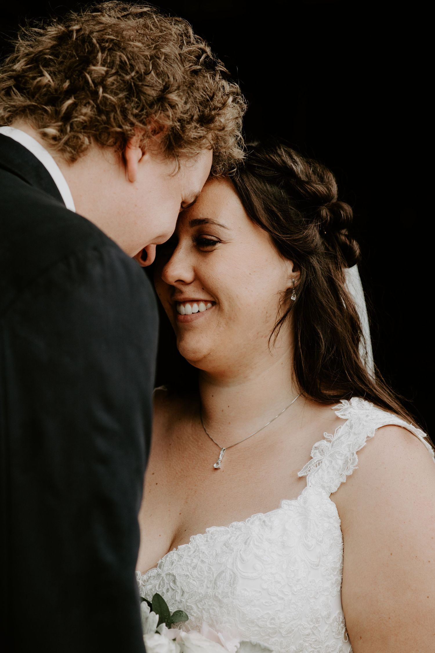 bride and groom giggling