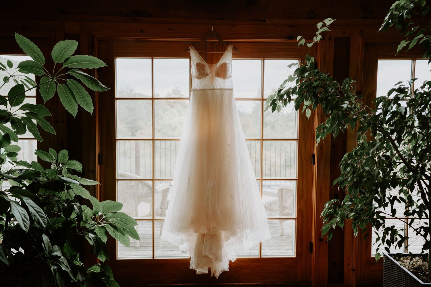 dress hung in window at log cabin in Blue Mountains Ontario