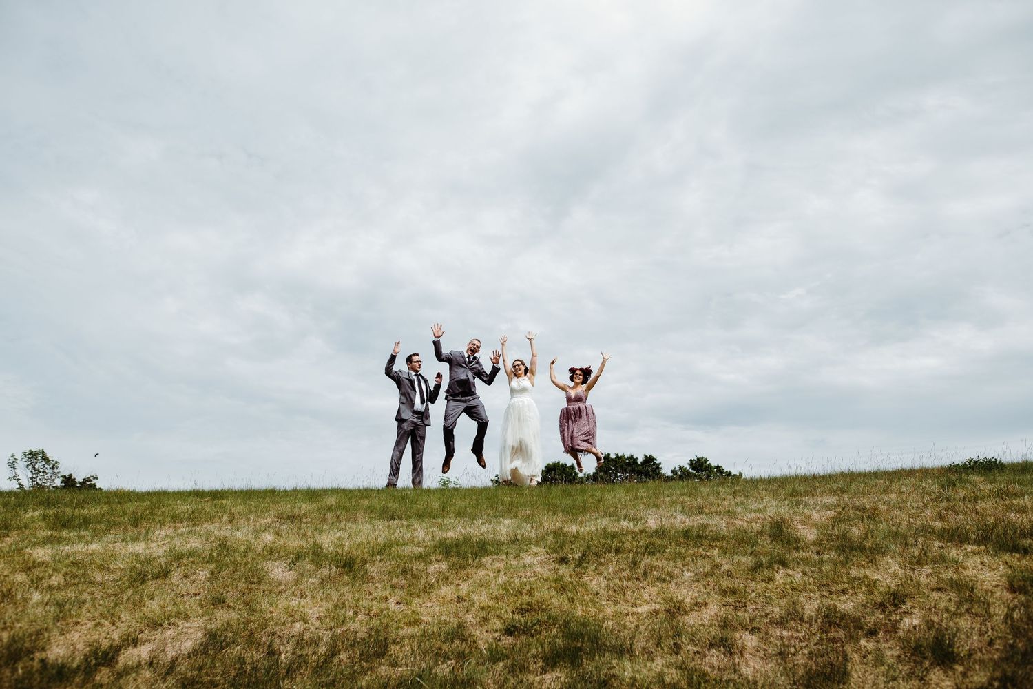 wedding party jump for joy at Georgian Bay Golf Club