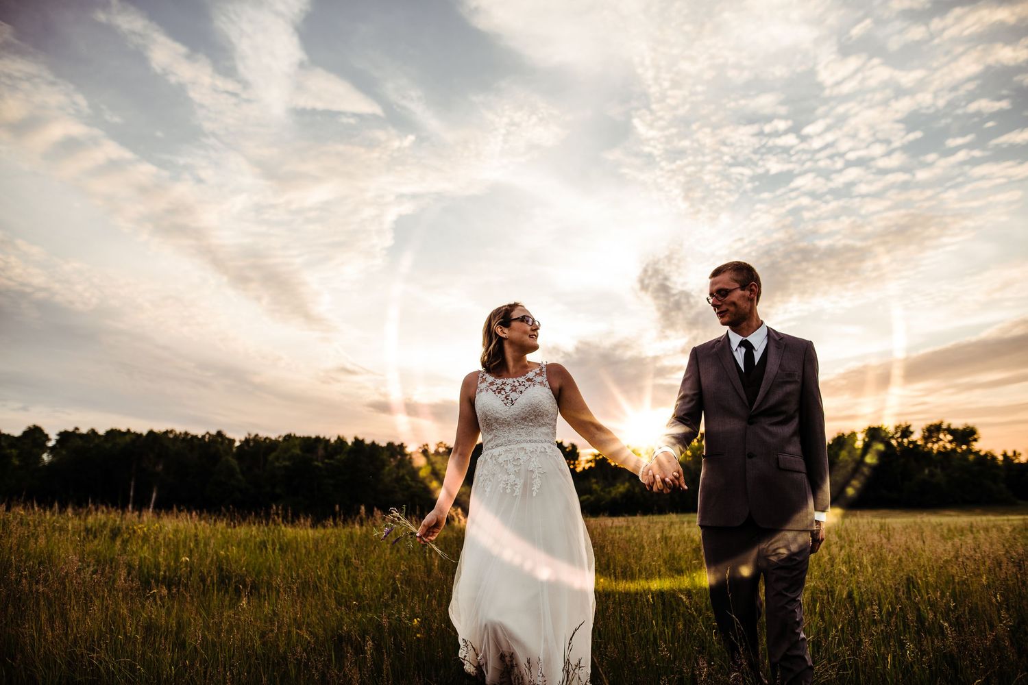 Sunset sun flair with bride and groom