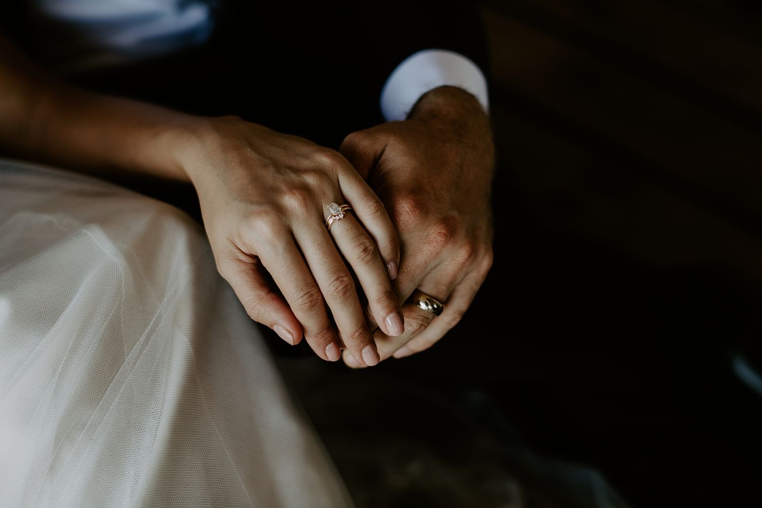 bride and groom holding hands