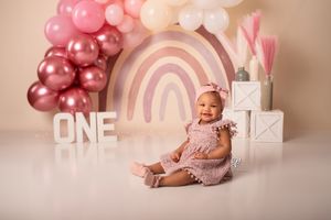 Lexington, SC Cake Smash birthday photographer; boho neutral rainbow balloon arch Lexington, SC Cake Smash session