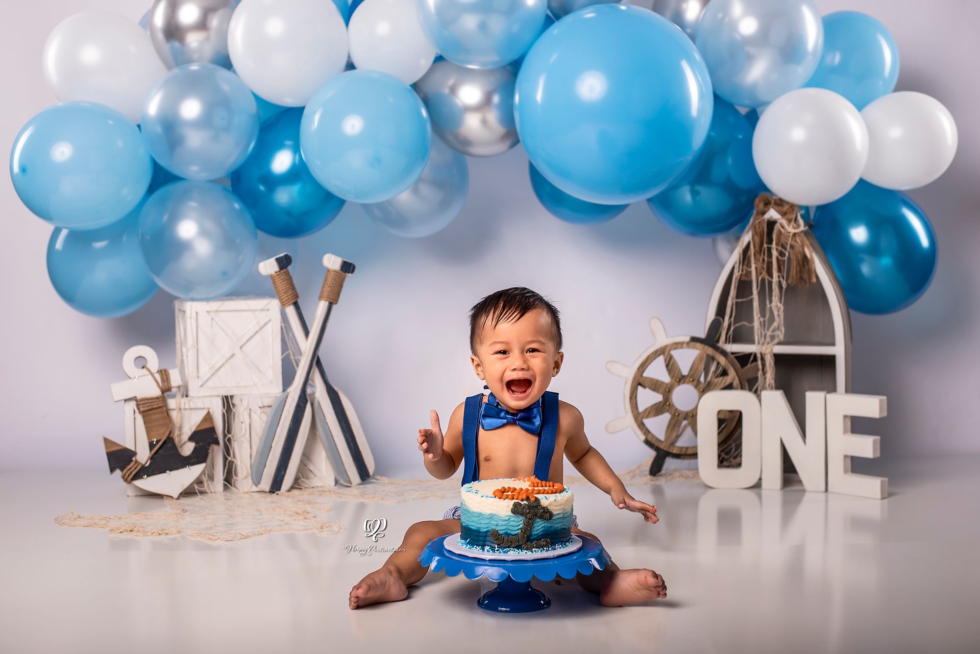 Cake Smash session one year old boy birthday photoshoot; South Carolina photographer; Lexington, SC; blue & white
