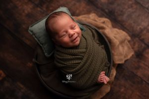 smiling newborn baby boy photography photoshoot; baby pictures Lexington, SC; best photographer South Carolina; baby boy