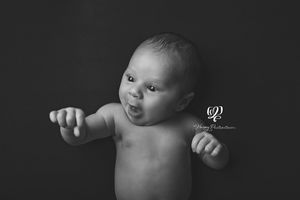 black and white newborn baby boy photo; personality baby pictures; Best newborn photographer Lexington, SC; portrait