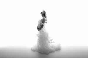 Black & white photo pregnant mama wearing white tulle dress from Client Closet; maternity photography Lexington, SC