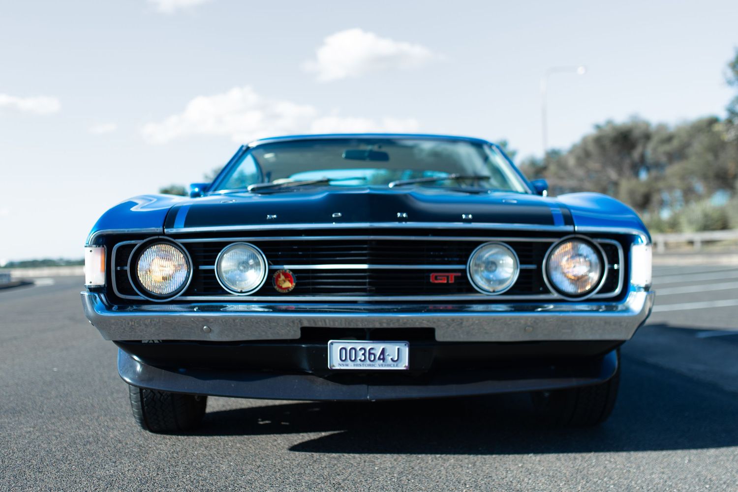 Front view of original blue Ford XY GT Falcon showing distinctive quad headlights.