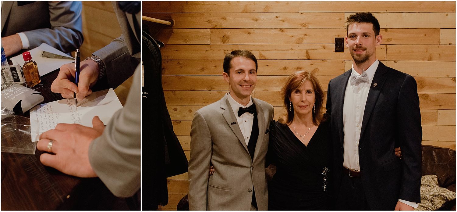 Wedding party members gather for formal photos in rustic indoor setting.