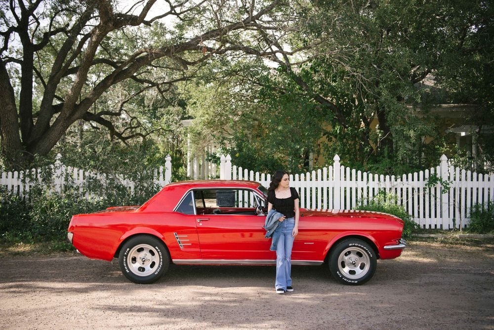 Beautiful girl posting in front of the car. Memory Lane Photo Spot. Mission, Texas