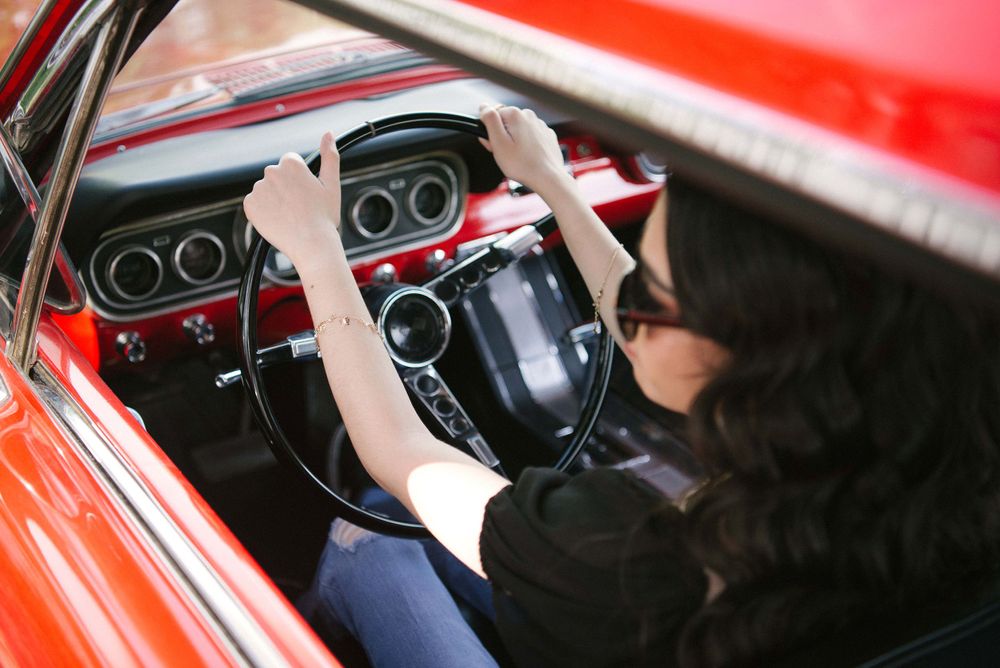 driving a beautiful red car. quinceañera modeling. Memory Lane Photo Spot. Mission, Texas