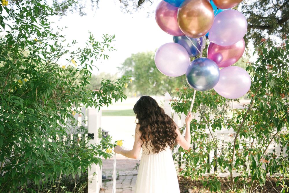 Girl posting with balloons at her casual Photo shoot. Memory Lane Photo Spot. Mission, Texas