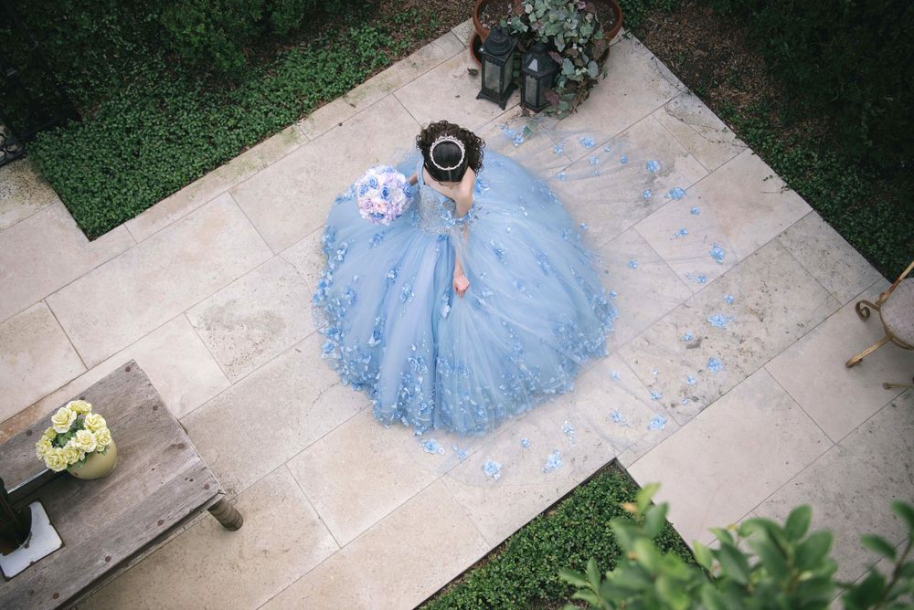 Bird view of a quinceañera girl posing with her dress. Casa polonia in weslaco texas