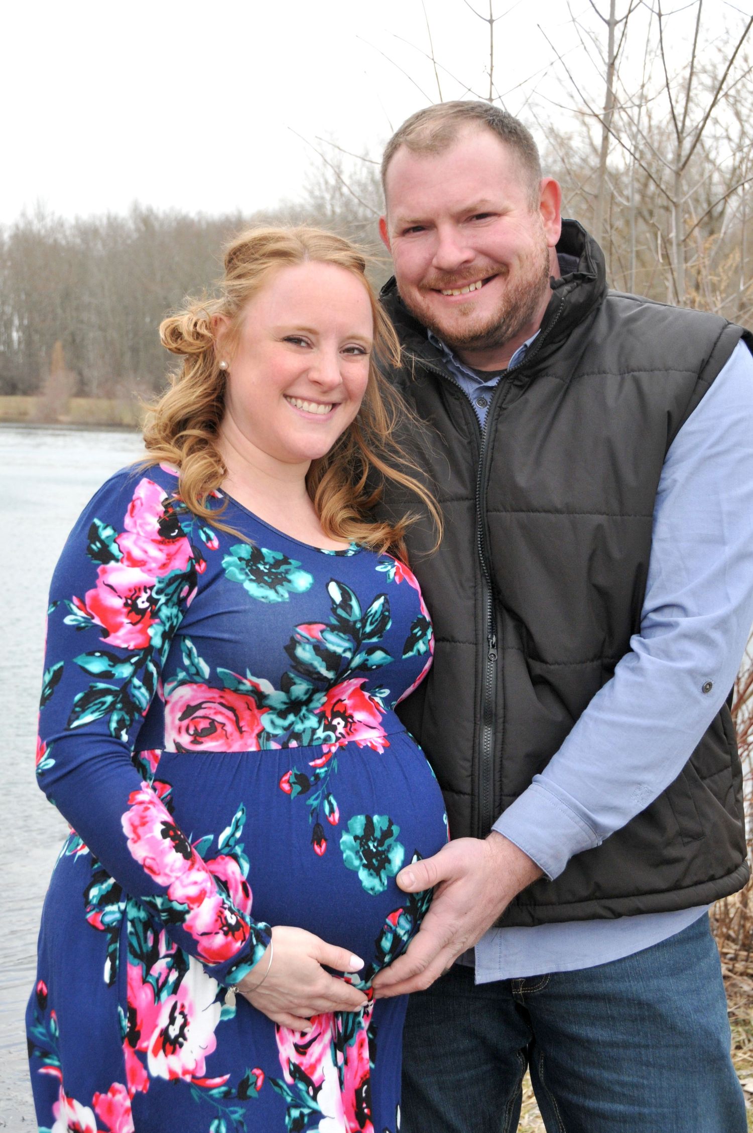 outside maternity photo of parents in color