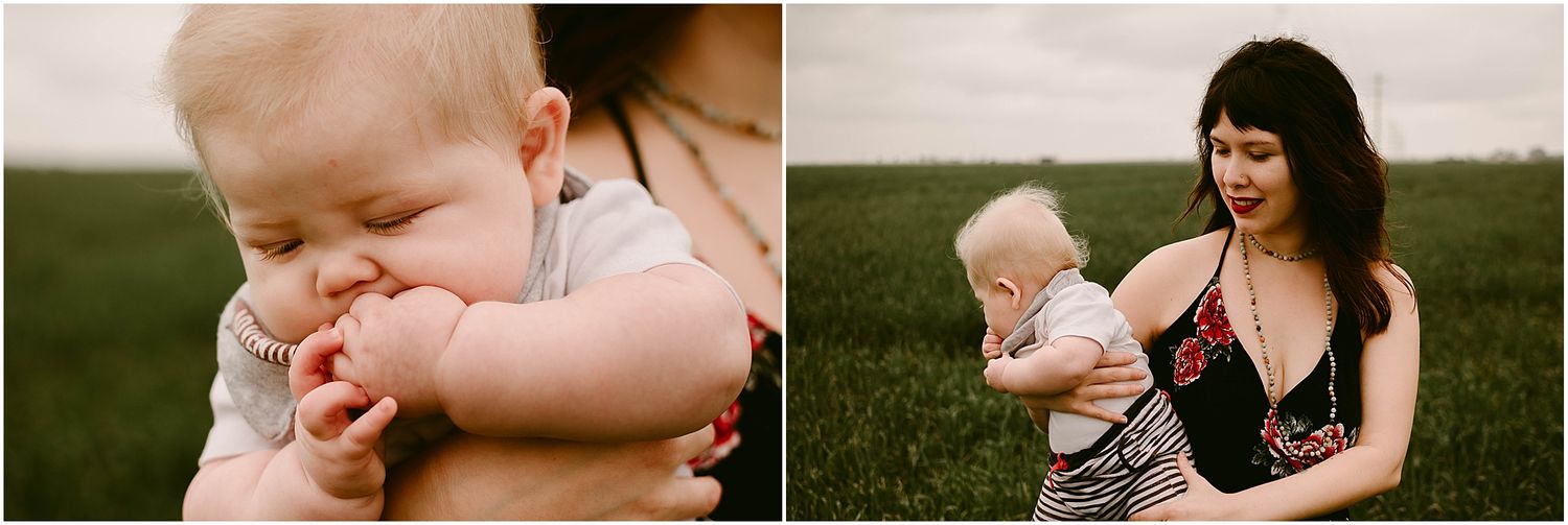 A sweet outdoor portrait showing a tender moment between adult and baby against a grassy field.