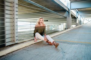 Urban photography series in concrete parking structure showing creative angles and poses.