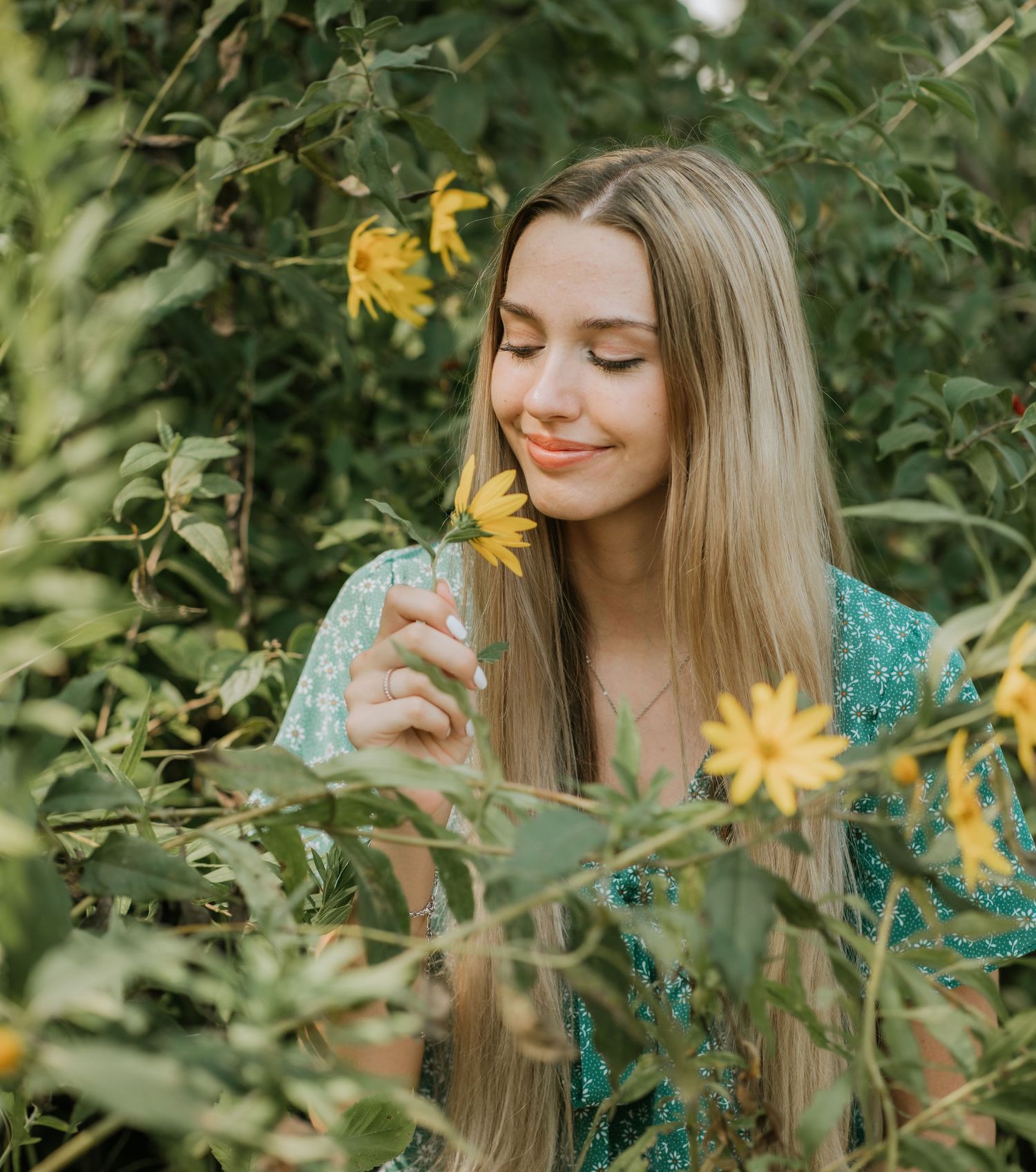 woman smelling flowers