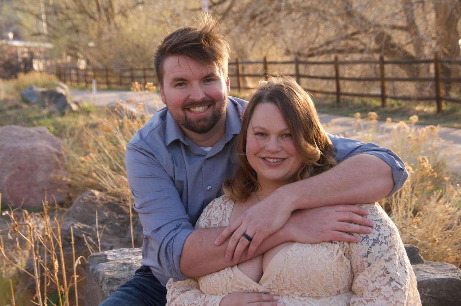 A Family portrait photo showing a man and women hugging for the website WhiteFlamingoPhotos.com